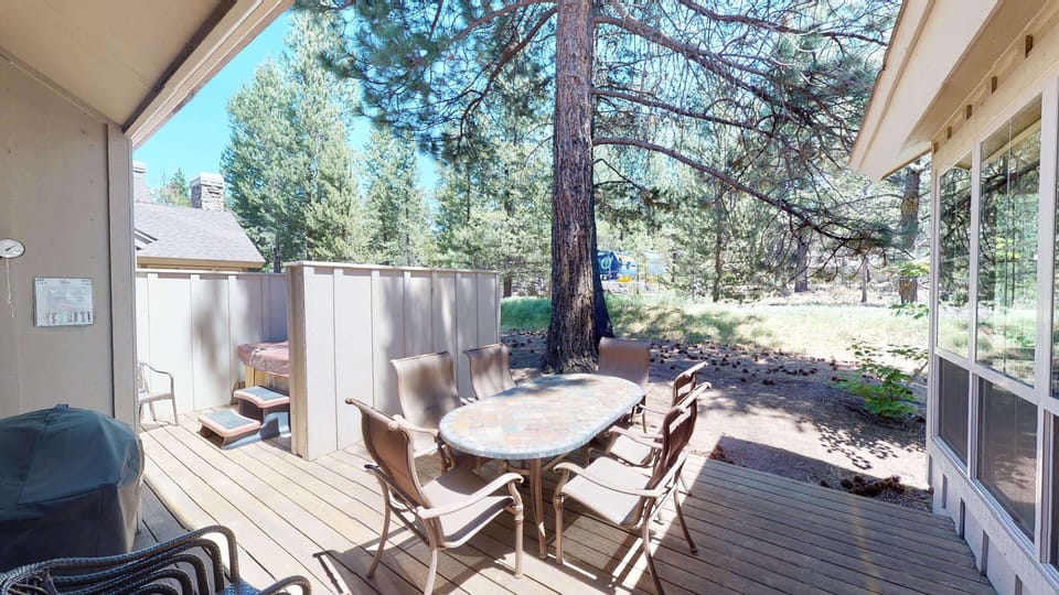 Unwind in the illuminated hot tub surrounded by natural rock features, then take a dip in the adjacent pool—all under dramatic timber beams and bright skylights.