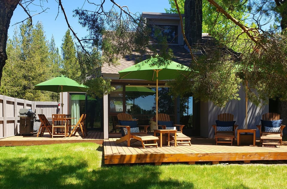 Unwind in the illuminated hot tub surrounded by natural rock features, then take a dip in the adjacent pool—all under dramatic timber beams and bright skylights.