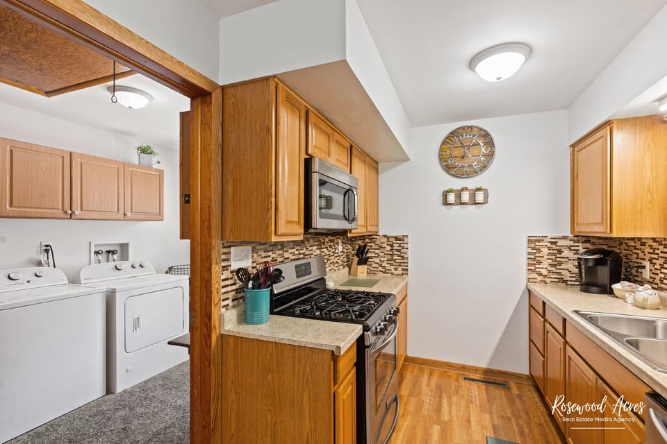 Kitchen area that looks into laundry area