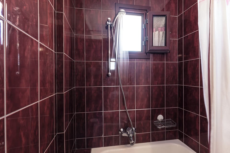 Junior Suite, Sea View | Bathroom | Bathtub, hair dryer, towels, soap