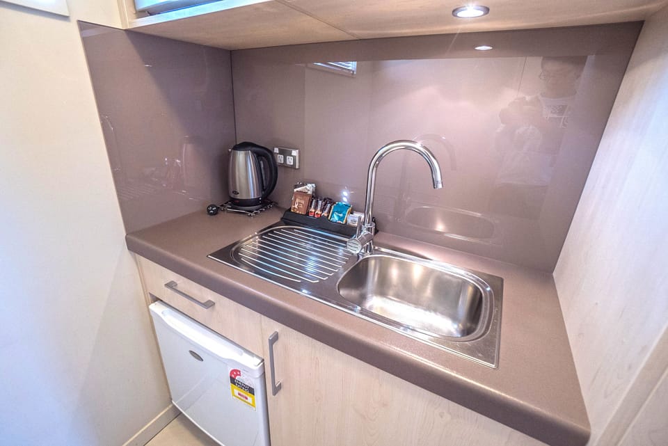 Coffee/tea maker, fridge, microwave