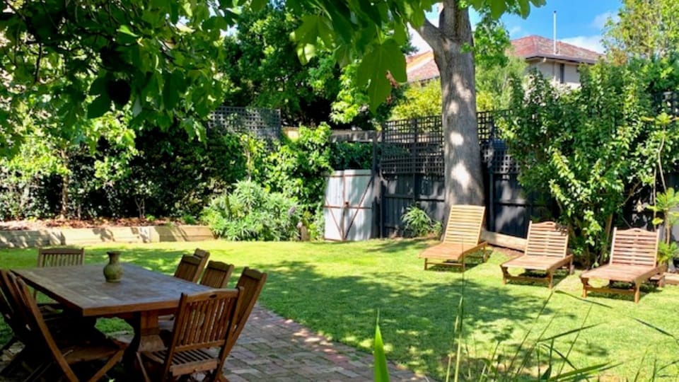 Spacious, sunny garden with outdoor seating