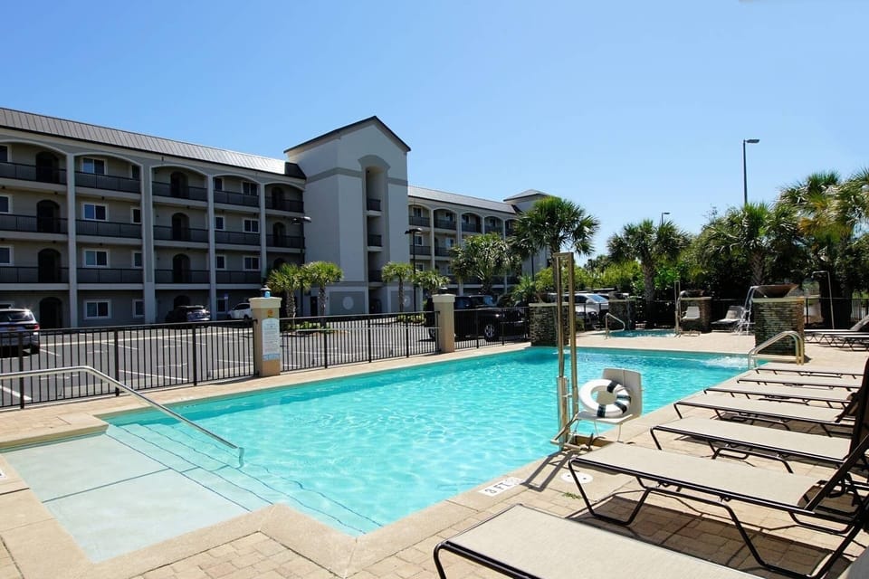 The beautiful hot tub with water features and large heated swimming pool is available to all guests. 