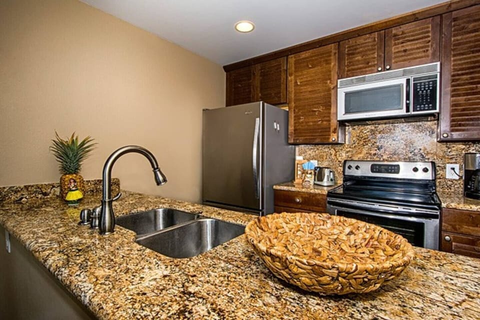 Full kitchen with many appliances 