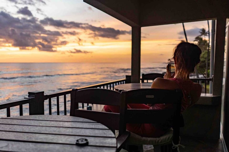 Jennifer watching the surfers at sunset.