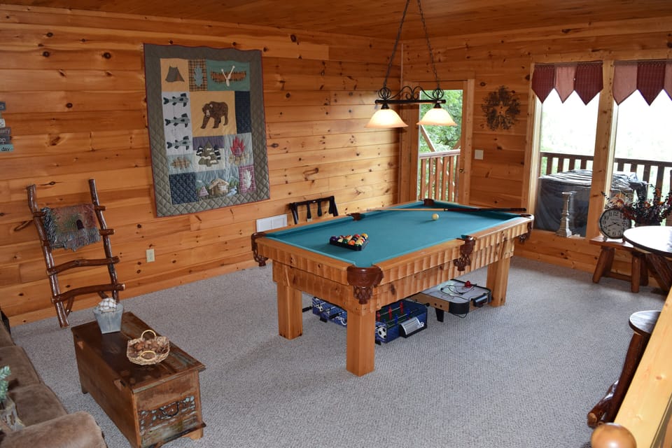 Downstairs Game Room with Pool Table looking out to lower deck         