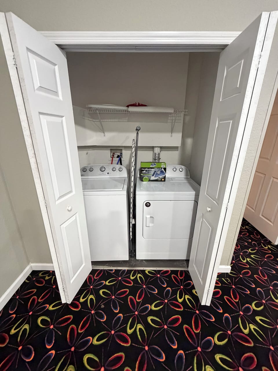 Laundry Unit featuring a washing machine and Dryer. 12 minutes to Disney