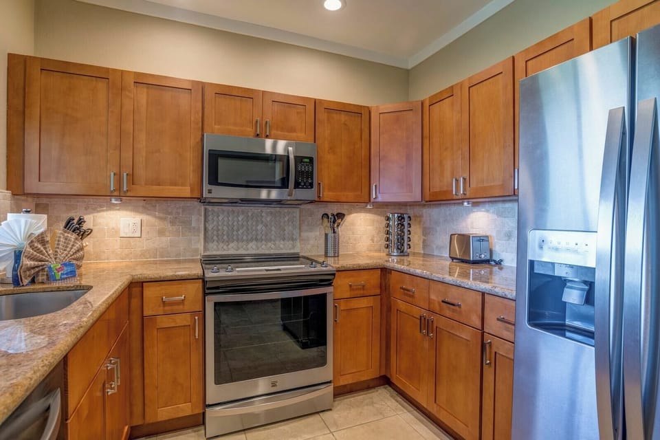 The warmth of the wood, the sleek appliances—this kitchen is where style meets everyday convenience