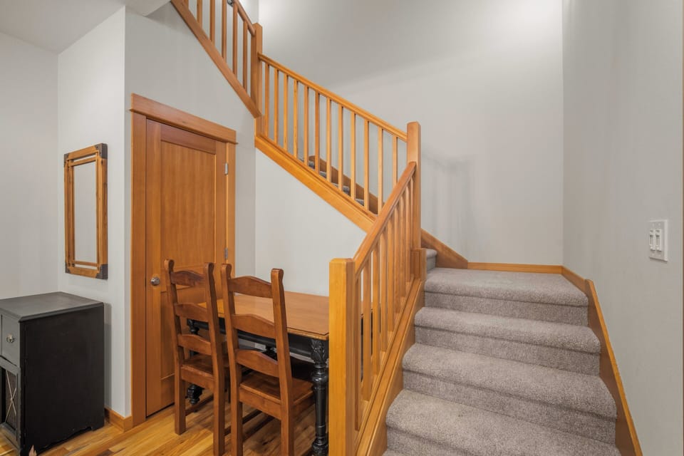 Freshen up in your private bathroom featuring elegant granite countertops, plush towels, and modern fixtures for a comfortable stay.
