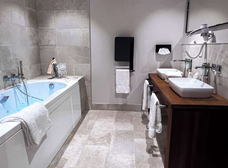 Family Room, 1 King Bed, Non Smoking (Converts to 2 Twin Beds;with Sofabed) | Bathroom | Shower, hair dryer, towels, soap