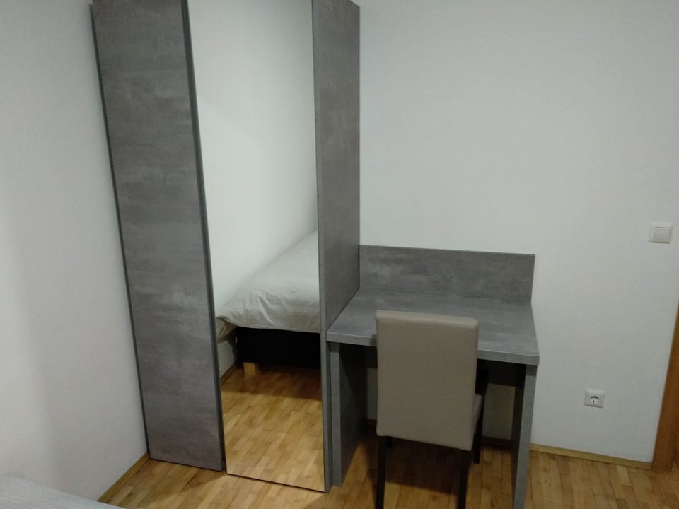 Family Apartment, Multiple Beds, Garden View | Desk, laptop workspace, blackout drapes, soundproofing