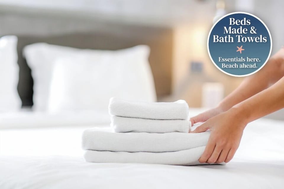 Your fresh linens await—crisp sheets, fluffy towels, and a perfectly made bed so you can unpack, relax, and enjoy your beach getaway from day one.