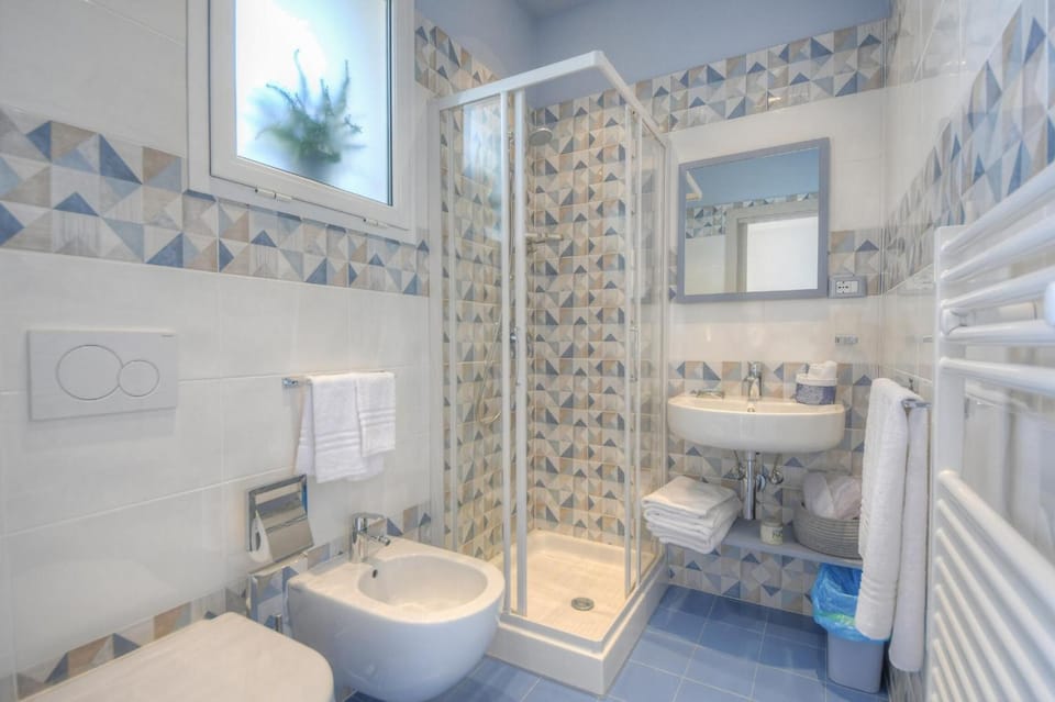 Shower, free toiletries, hair dryer, slippers