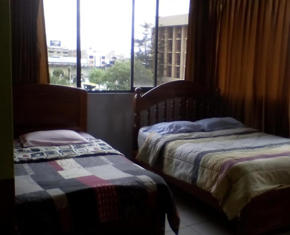 Family Room, Multiple Beds, City View | Free WiFi, bed sheets