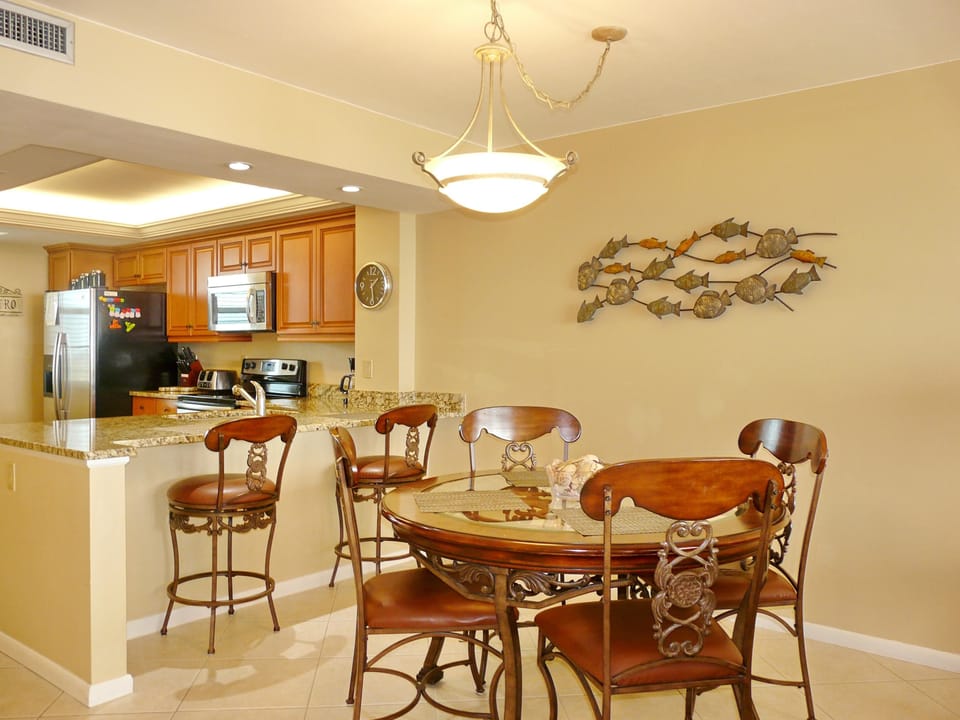 Condo, Multiple Beds (Stylish beachfront condo with pool an) | In-room dining