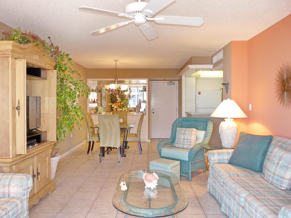 Condo, Multiple Beds (Alluring beachfront condo with pool a) | Living area | Flat-screen TV