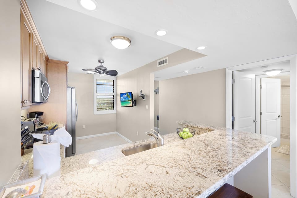 Condo, 1 King Bed with Sofa bed (Alluring beachfront condo with pool a) | Private kitchen | Fridge, microwave, oven, stovetop