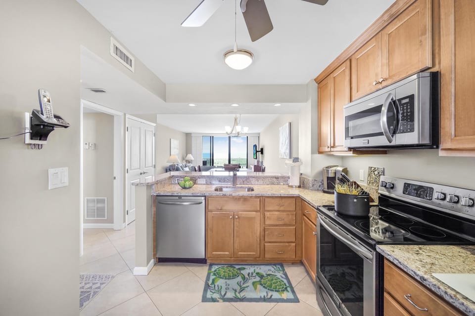 Condo, 1 King Bed with Sofa bed (Alluring beachfront condo with pool a) | Private kitchen | Fridge, microwave, oven, stovetop