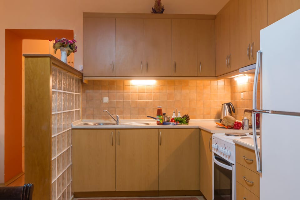 Apartment, 2 Bedrooms | Private kitchen | Full-size fridge, oven, stovetop, cookware/dishes/utensils