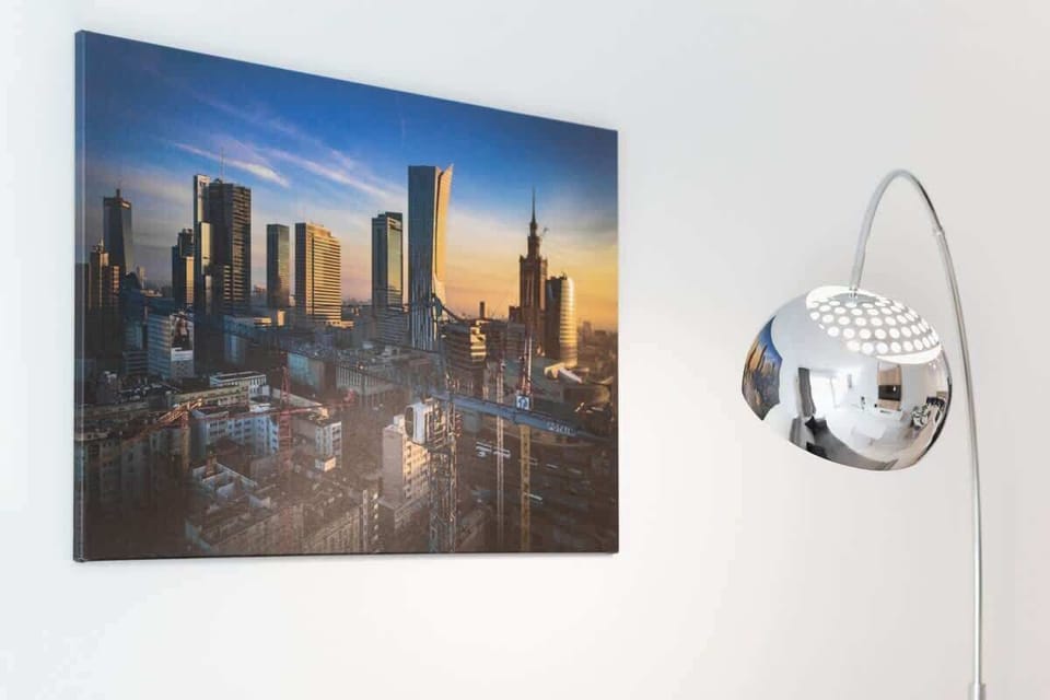 A living room decorated with a cityscape artwork, creating a sophisticated urban vibe.