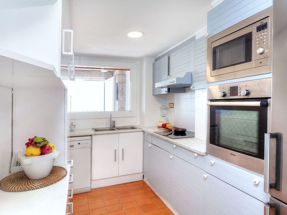 Property, Room, Furniture, Kitchen, Cabinetry, Building, Interior Design, Countertop, House, Yellow