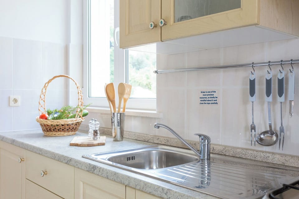 The well-equipped kitchen space features modern appliances and ample counter space, ideal for preparing delicious home-cooked meals.