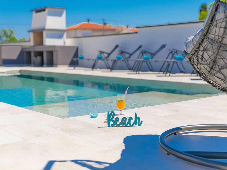 Water, Blue, Swimming Pool, Azure, Building, Outdoor Furniture, Sunlounger, Sky, Aqua, Leisure