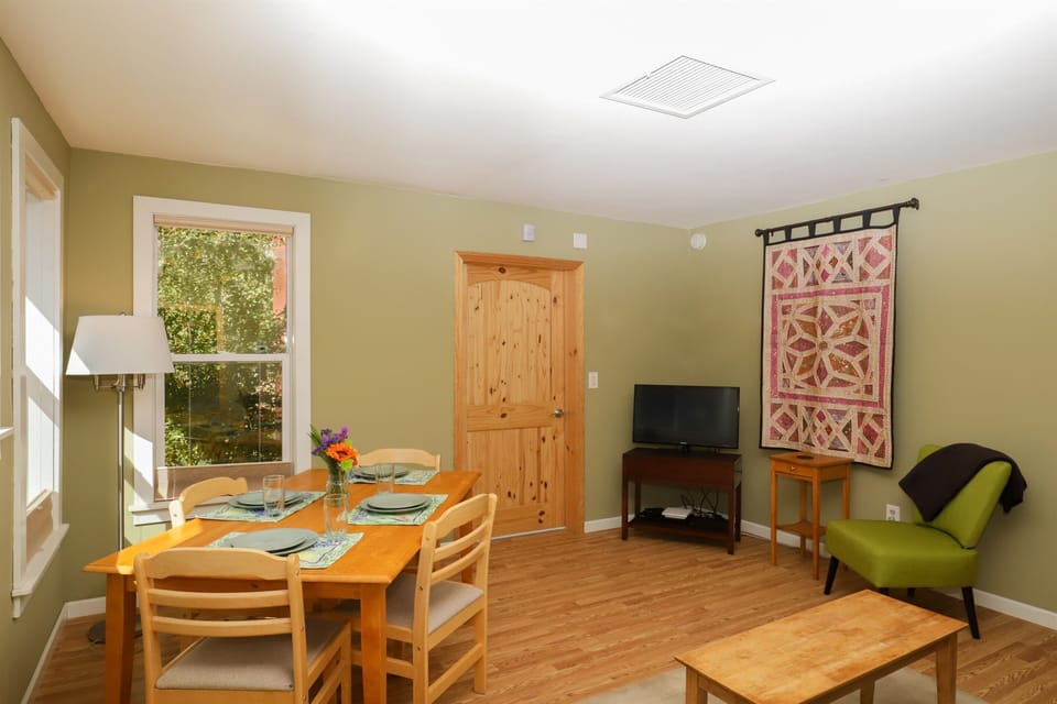 Living and dining area.  Door to gear storage area.