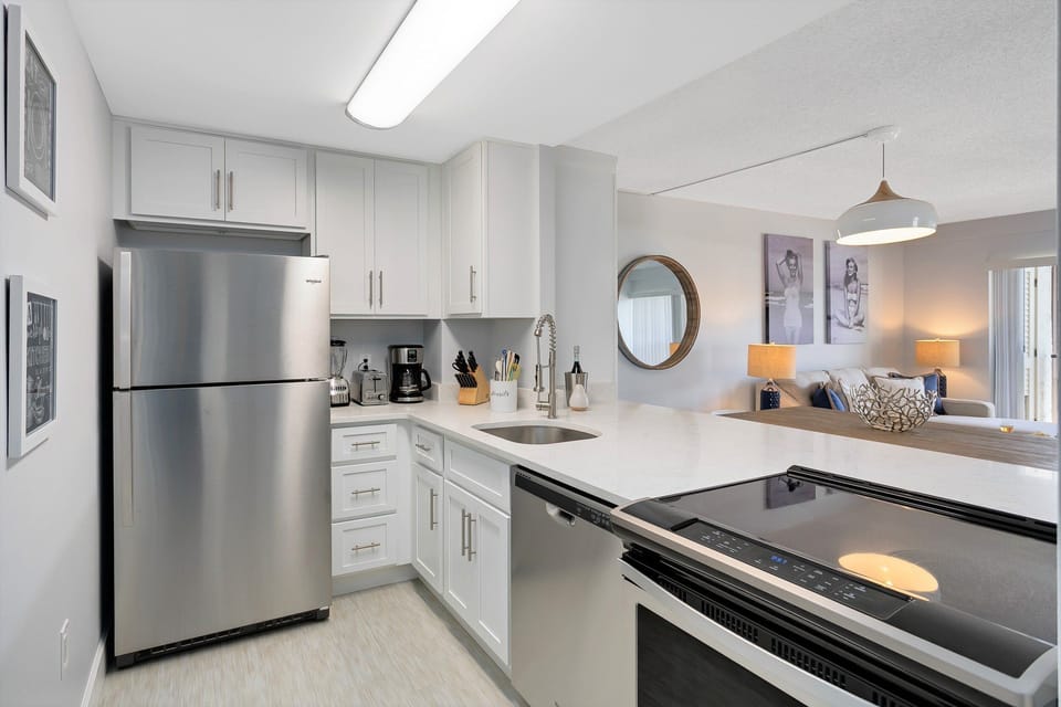 Modern kitchen with sleek stainless steel appliances and quartz countertops