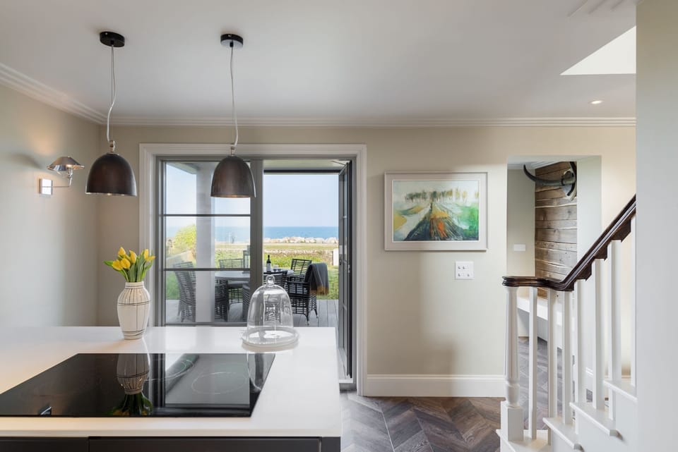 View from kitchen to front patio and sea beyond - Beam Ends