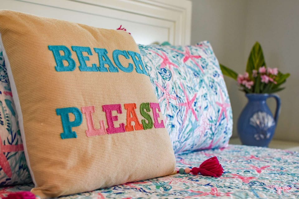 Cozy and beachy chic decor create a cheerful and relaxing environment.