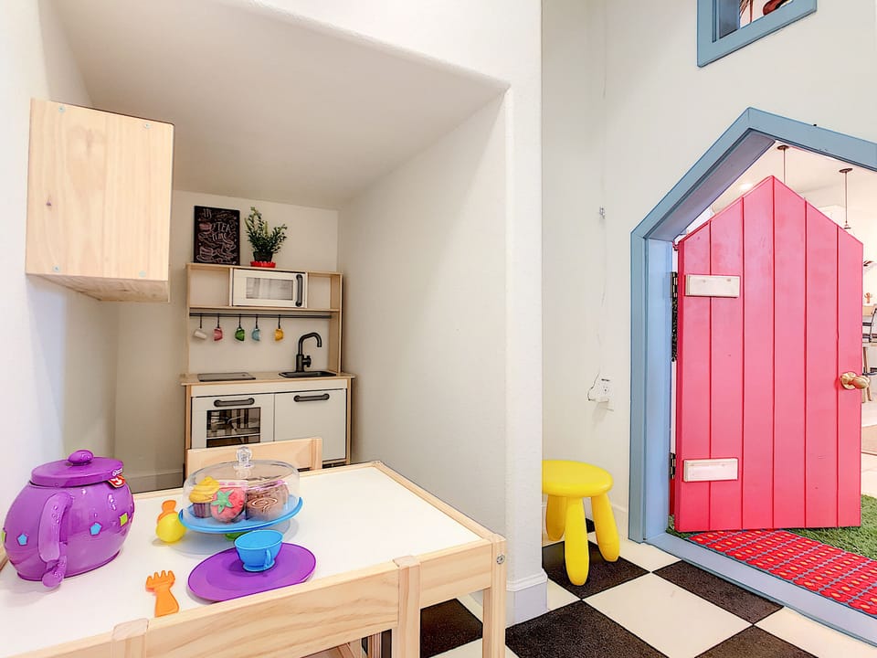 Step inside the Mad Hatter House where you’ll find a full play kitchen for kids!