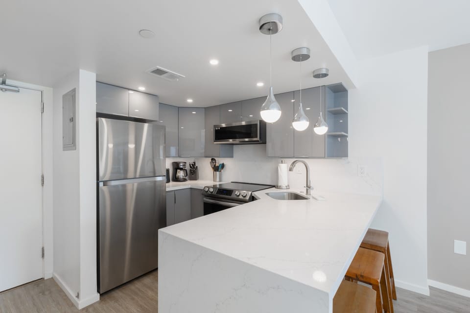 Cozy up to the bar in the renovated kitchen - perfect for remote work as well!