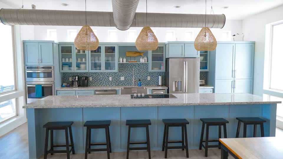 Beautiful kitchen with huge island, views of beach and bay views as well.