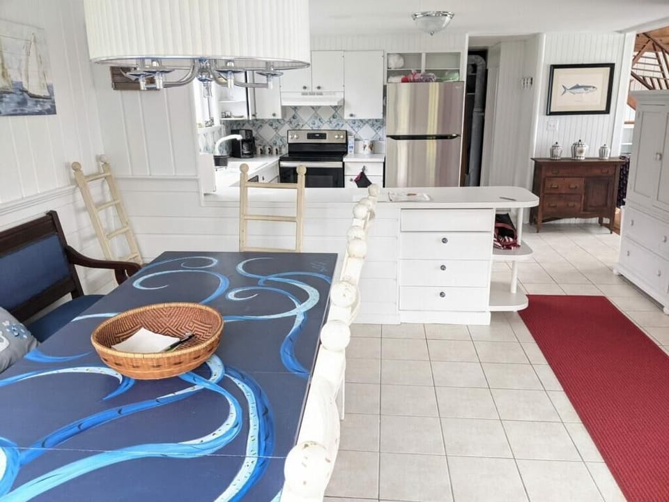 Large fully equipped kitchen, family style dining table with room for 12. 