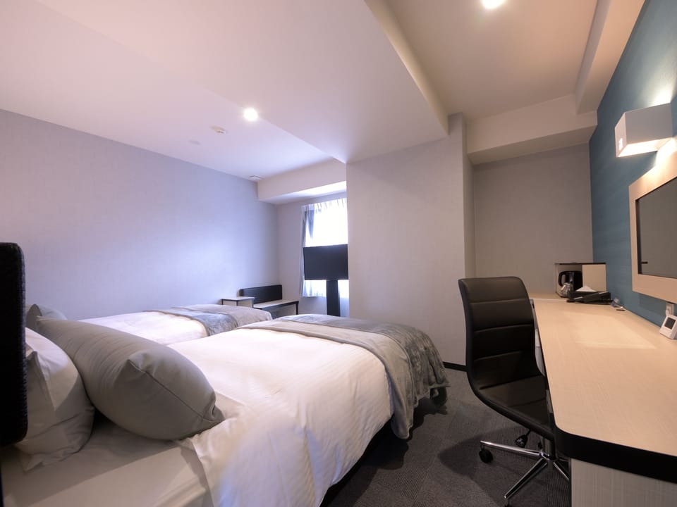 Twin Room, 2 Wide Beds, Non Smoking (B) | Down comforters, desk, laptop workspace, blackout drapes