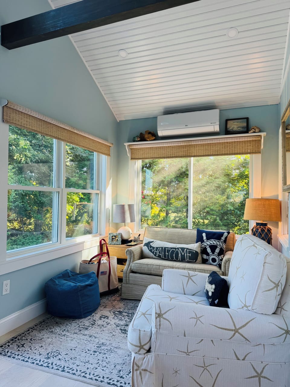 Airy porch seating area with peekaboo ocean views-a great spot for reading