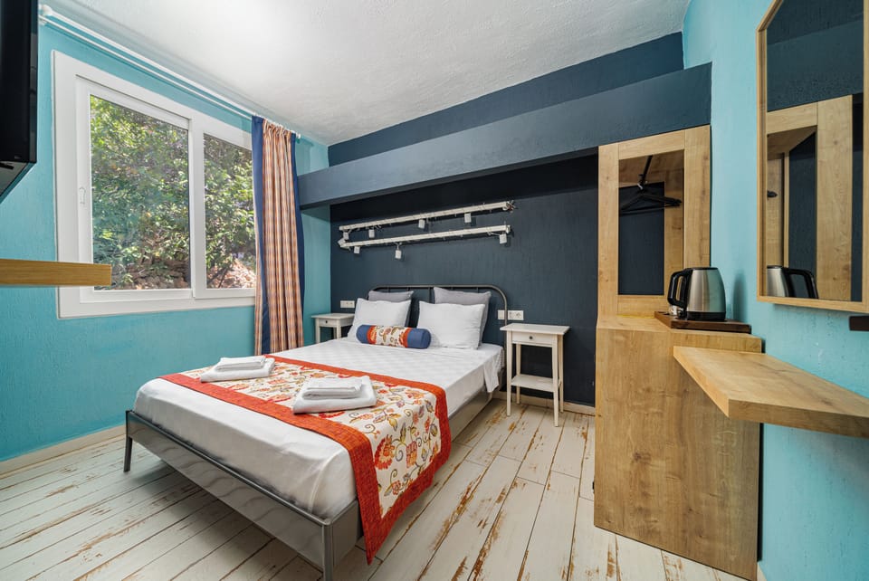 Family Quadruple Room, Garden View | 1 bedroom, in-room safe, desk, free WiFi