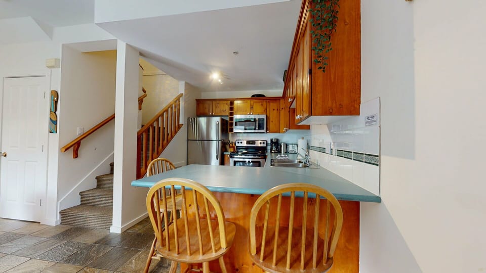 Kitchen w/ Stainless Steel Appliances & Breakfast Bar