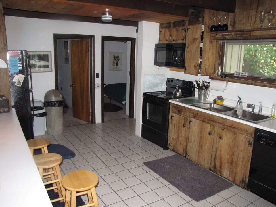 Fully applianced kitchen (view of 2 1st fl bdrms & full bath)