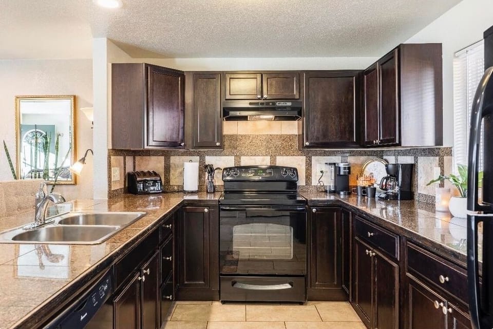 Updated kitchen with granite tile countertops and brand new refrigerator!