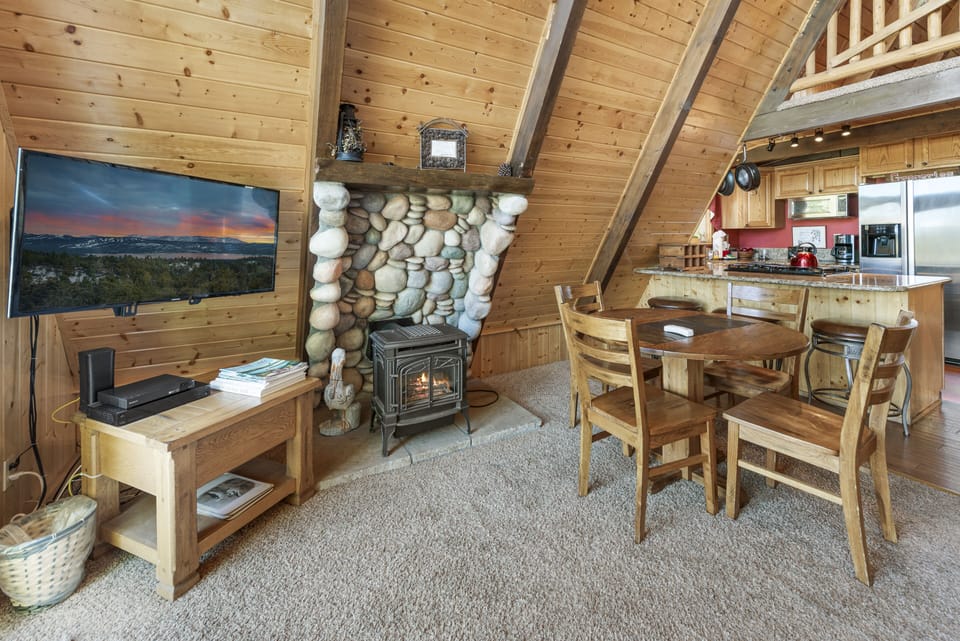 Living Room - Living room with TV and fireplace! A large chair in the living room opens into a bed. TWIN. (1 person)
