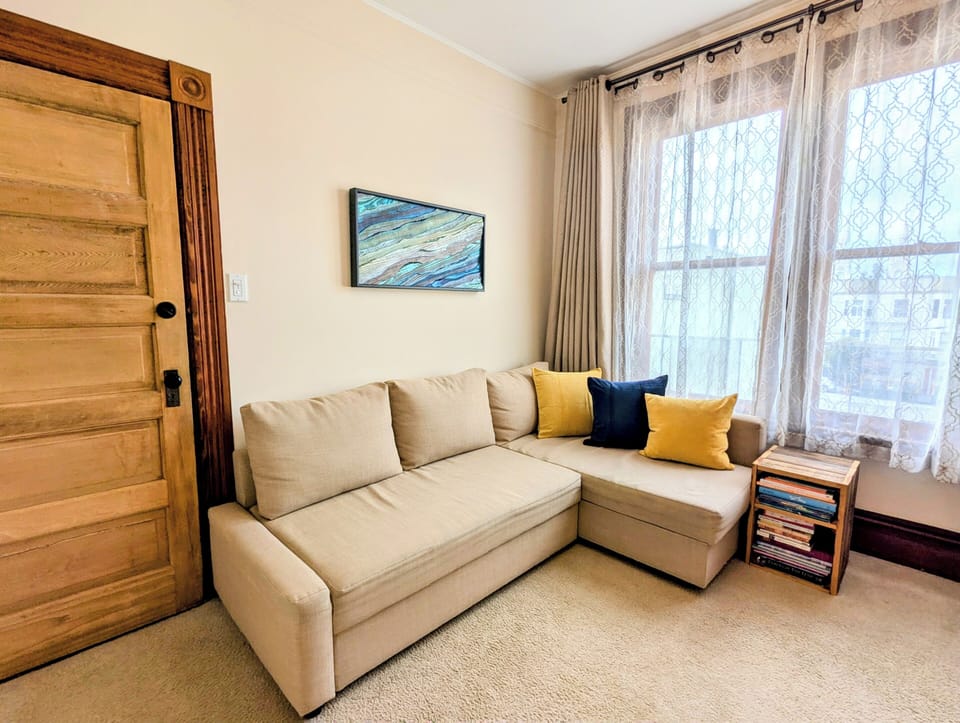 Room 1: can be set up as a living room or private bedroom with its own door