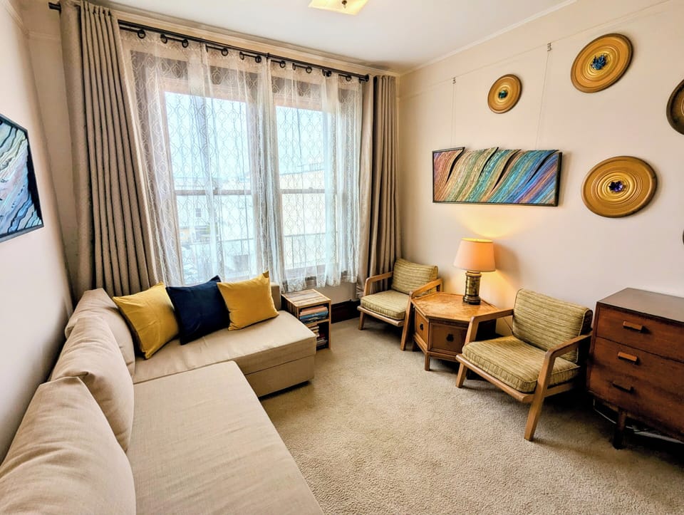 Room 1: can be set up as a living room or private bedroom with its own door