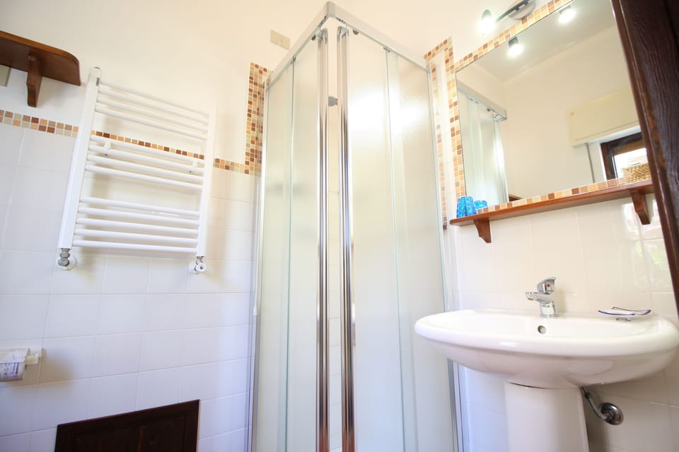Panoramic Triple Room, Multiple Beds, Terrace | Bathroom | Shower, hair dryer, bidet, towels