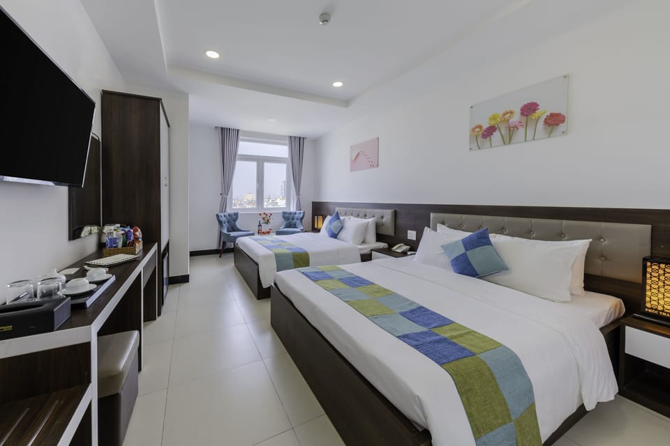 Deluxe Quadruple Room | Minibar, desk, laptop workspace, soundproofing
