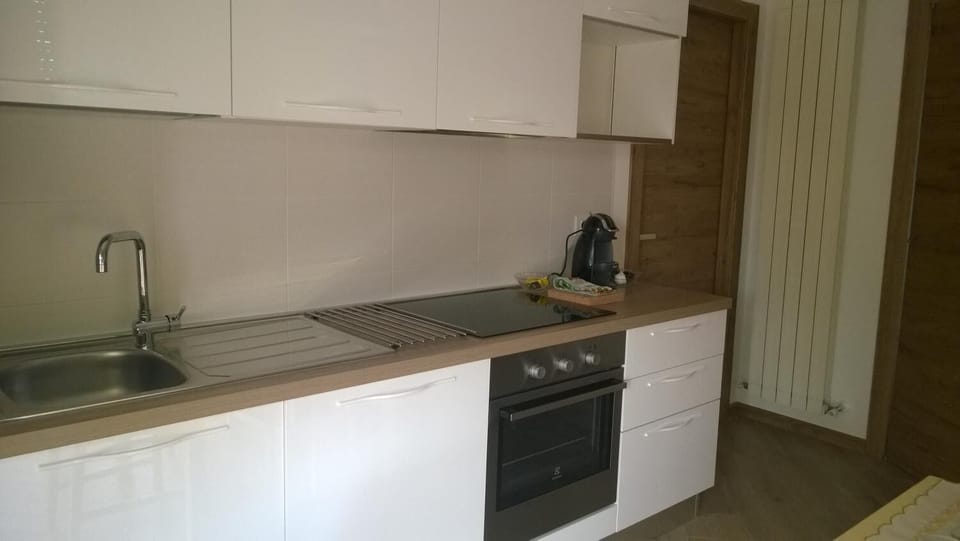 Fridge, stovetop, coffee/tea maker, cookware/dishes/utensils