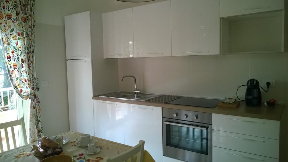 Fridge, stovetop, coffee/tea maker, cookware/dishes/utensils