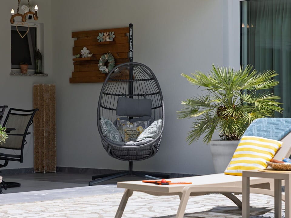 Furniture, Chair, Outdoor Furniture, Cushion, Throw Pillow, Floor, Flowerpot, Living Room, Wicker, Couch