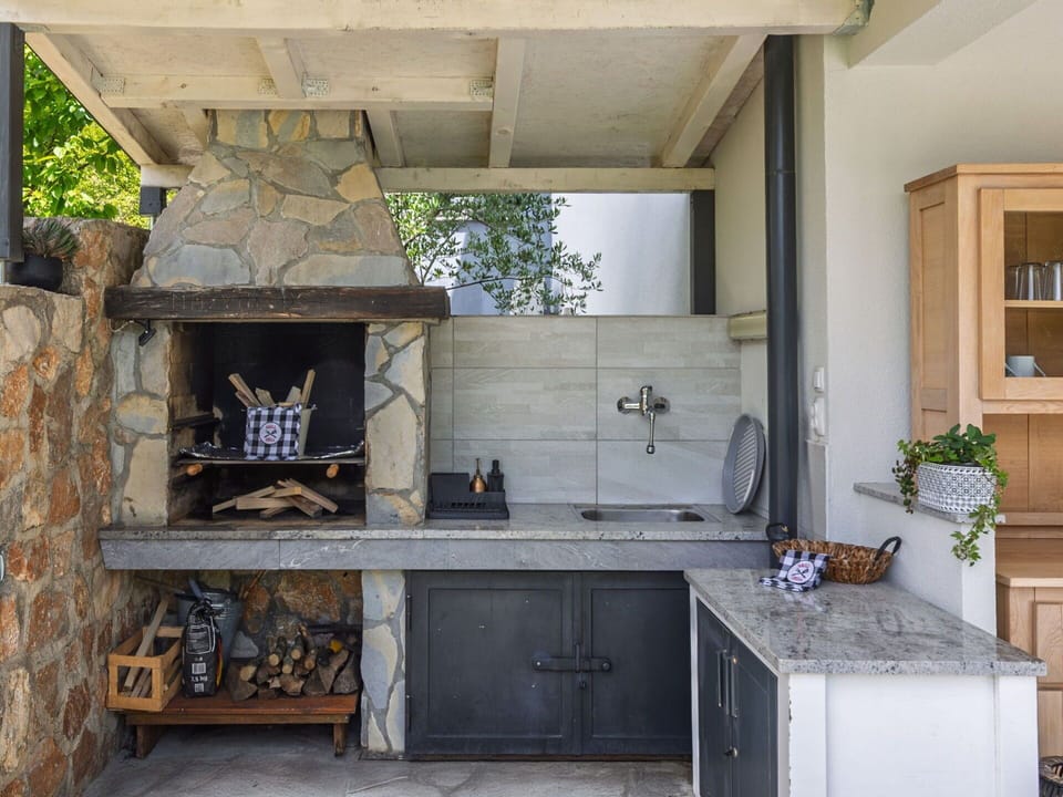 Natural Material, Kitchen, Design, Tile, Stove, Chimney, Stone Wall, Flagstone, Houseplant, Limestone